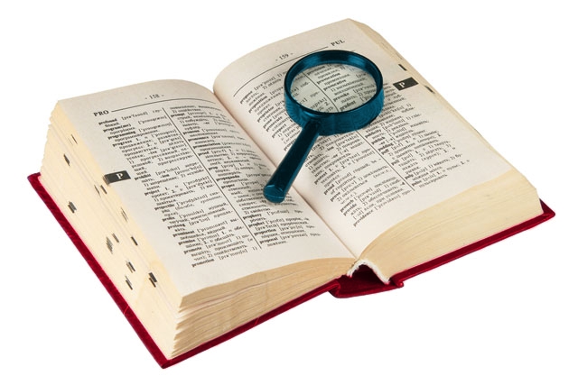 Dictionary with magnifying glass